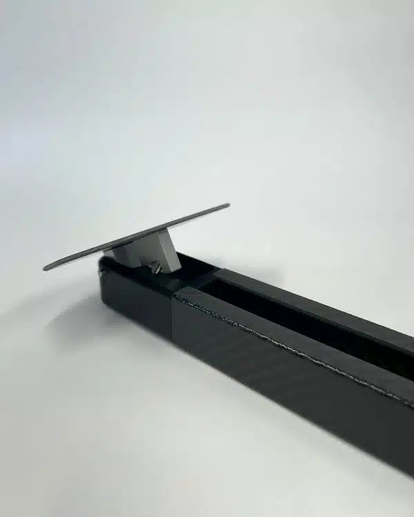 Aluminium pedal forks on updated Onehundred Boardz carbon mast track, replacing plastic for higher durability in Raceboard and Division II windsurfing.